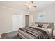 Well-lit staged bedroom with a large closet, neutral walls, and comfortable bedding at 1383 Almont Sw Dr, Atlanta, GA 30310