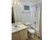 Bathroom features a white vanity, toilet, and shower-tub combination with tile surround at 9400 Roberts Dr # 6C, Atlanta, GA 30350