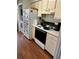 Kitchen with hardwood flooring and appliances at 9400 Roberts Dr # 6C, Atlanta, GA 30350