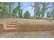 Fenced backyard with brick steps at 966 Ashby Grove Sw St, Atlanta, GA 30314