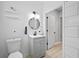 Sleek bathroom with gray vanity, modern fixtures, and tiled walls at 966 Ashby Grove Sw St, Atlanta, GA 30314