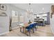 Inviting dining room with modern lighting and an open view to the kitchen at 966 Ashby Grove Sw St, Atlanta, GA 30314