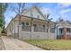 Charming renovated home featuring a covered front porch and stone foundation at 966 Ashby Grove Sw St, Atlanta, GA 30314