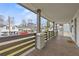 Covered front porch featuring wooden floors and a wooden railing at 966 Ashby Grove Sw St, Atlanta, GA 30314