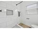 Stylish shower with white subway tile, black fixtures, and a built-in niche at 966 Ashby Grove Sw St, Atlanta, GA 30314