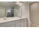 Bathroom featuring a double sink vanity with modern fixtures and a tiled shower at 113 Belvedere Rd, Mcdonough, GA 30253