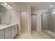 Bright bathroom showcasing wood flooring, double sink vanity, and glass-enclosed shower at 113 Belvedere Rd, Mcdonough, GA 30253