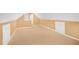View of an attic area with carpet, tan walls, and white trim and built in cabinets at 1584 Snow Hill Dr, Lawrenceville, GA 30045