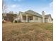View of a house's backyard featuring a patio and a chimney at 1584 Snow Hill Dr, Lawrenceville, GA 30045