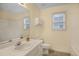 Cozy bathroom features a single vanity, toilet and tub and shower combo at 1584 Snow Hill Dr, Lawrenceville, GA 30045