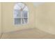Cozy bedroom with a large window, carpet, and neutral walls at 1584 Snow Hill Dr, Lawrenceville, GA 30045