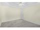 Neutral bedroom featuring a trey ceiling, neutral carpet and single door access at 1584 Snow Hill Dr, Lawrenceville, GA 30045