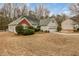 A well-maintained single-story home featuring a neat yard and attached two-car garage at 1584 Snow Hill Dr, Lawrenceville, GA 30045