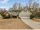 Charming single-story home with a well-manicured lawn and attached two-car garage at 1584 Snow Hill Dr, Lawrenceville, GA 30045