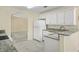 Bright kitchen with white cabinets, granite countertops, and stainless steel appliances at 1584 Snow Hill Dr, Lawrenceville, GA 30045