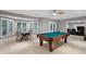 A basement with a pool table and large windows at 2728 Long Grove Dr, Marietta, GA 30062
