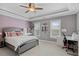 Bedroom with bed, desk, chair, and double windows with blinds at 2728 Long Grove Dr, Marietta, GA 30062