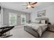 A bedroom with carpet, ceiling fan, study, and double windows with blinds at 2728 Long Grove Dr, Marietta, GA 30062