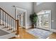 Bright foyer features hardwood floors, white trim, and double doors leading to the home's exterior at 2728 Long Grove Dr, Marietta, GA 30062