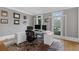 Bright home office with white modern desk, ample natural light, and refined decor for productivity at 2728 Long Grove Dr, Marietta, GA 30062