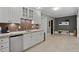 A kitchenette with granite countertops and stainless steel refrigerator at 2728 Long Grove Dr, Marietta, GA 30062