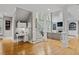 Bright living room with hardwood floors, fireplace, built-in shelving, and large windows, showcasing modern design at 2728 Long Grove Dr, Marietta, GA 30062
