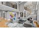 Open-concept living room with soaring ceilings, a staircase, and stylish decor for comfortable living at 2728 Long Grove Dr, Marietta, GA 30062