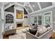 Cozy living room features a fireplace, built-in shelving, and large windows providing an abundance of natural light at 2728 Long Grove Dr, Marietta, GA 30062