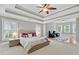 Spacious main bedroom with a tray ceiling, sitting area, and plush carpeting for ultimate relaxation at 2728 Long Grove Dr, Marietta, GA 30062
