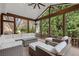 Relaxing sunroom with comfortable seating and views of the lush green landscape at 2728 Long Grove Dr, Marietta, GA 30062