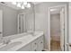 Bathroom with a double sink vanity, large mirror, and a separate toilet and shower room at 30 Barbara Ct, Fayetteville, GA 30215