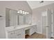 Bathroom with double sinks, white cabinetry, and tile floors at 30 Barbara Ct, Fayetteville, GA 30215
