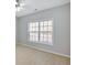 Bedroom with a large window with wooden blinds and neutral colored walls at 30 Barbara Ct, Fayetteville, GA 30215