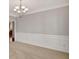 An elegant dining room showcasing wainscotting and a chandelier above at 30 Barbara Ct, Fayetteville, GA 30215