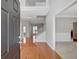 Bright foyer with hardwood floors, a staircase, and views into adjacent rooms creating an inviting entryway at 30 Barbara Ct, Fayetteville, GA 30215