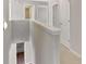 Upstairs hallway with view of downstairs and doors to bedrooms and bathrooms at 30 Barbara Ct, Fayetteville, GA 30215