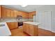 Open kitchen with stainless steel appliances and wooden cabinets at 30 Barbara Ct, Fayetteville, GA 30215