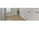 This laundry room features tile floor and natural light at 30 Barbara Ct, Fayetteville, GA 30215