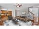 Open living area with fireplace, access to kitchen, hardwood floors, and natural light at 30 Barbara Ct, Fayetteville, GA 30215