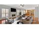 Open living area with fireplace, large windows, and access to the kitchen at 30 Barbara Ct, Fayetteville, GA 30215