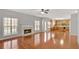 Spacious living room with fireplace, large windows, and wood flooring throughout at 30 Barbara Ct, Fayetteville, GA 30215