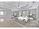Spacious main bedroom with tray ceiling, large windows, and neutral color palette at 30 Barbara Ct, Fayetteville, GA 30215