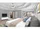 This main bedroom has a tray ceiling, ceiling fan and a seating area at 30 Barbara Ct, Fayetteville, GA 30215