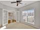 Bright office space featuring neutral walls, large windows, and double french doors at 30 Barbara Ct, Fayetteville, GA 30215