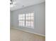 Sun-filled room with a ceiling fan and a large window providing ample natural light at 30 Barbara Ct, Fayetteville, GA 30215