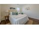 This bedroom features a plush bed, stylish decor, and hardwood floors at 3095 Wills Se St, Smyrna, GA 30080