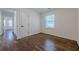 Bedroom with hardwood floors and a window with natural light and white painted trim and doors at 3095 Wills Se St, Smyrna, GA 30080