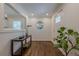 Stylish foyer featuring modern lighting, decorative mirror, and gleaming hardwood floors at 3095 Wills Se St, Smyrna, GA 30080