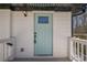 Inviting front door with glass insert, stylish light fixture, and freshly painted white siding at 3095 Wills Se St, Smyrna, GA 30080