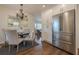 Open-concept kitchen and dining area with stainless steel refrigerator and hardwood floors at 3095 Wills Se St, Smyrna, GA 30080